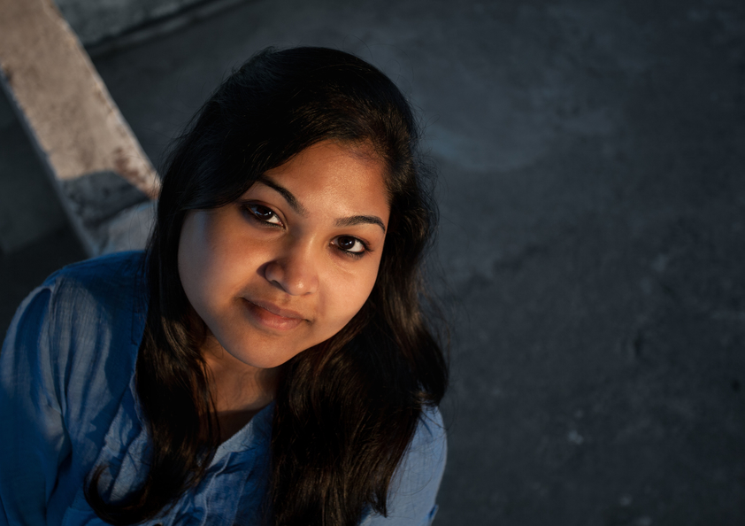 Homeschool teen gently smiling after taking SAT & ACT test